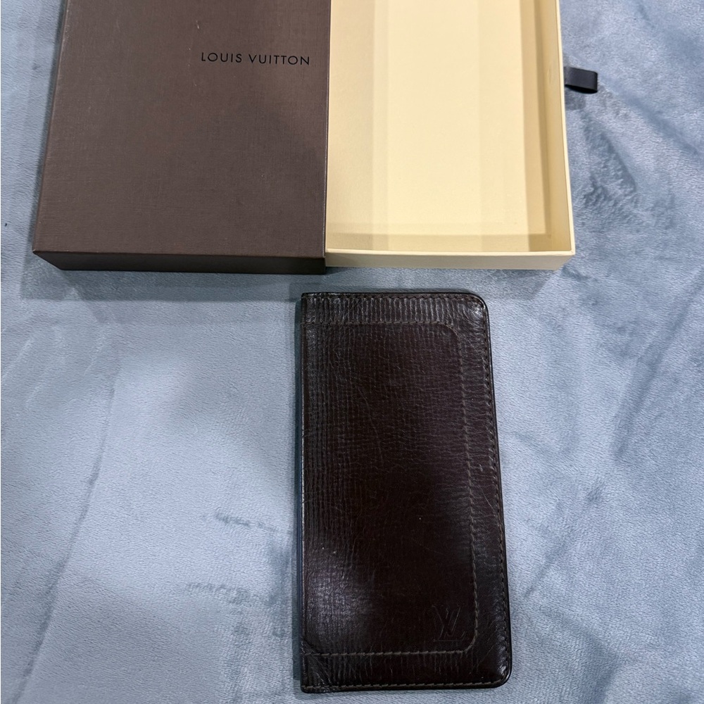 Louis Vuitton wallet in flawless condition. Has initials RY on inside.